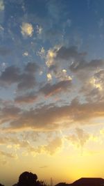 Low angle view of silhouette trees against sky during sunset