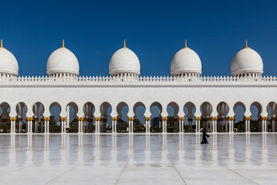 View of mosque against buildings in city