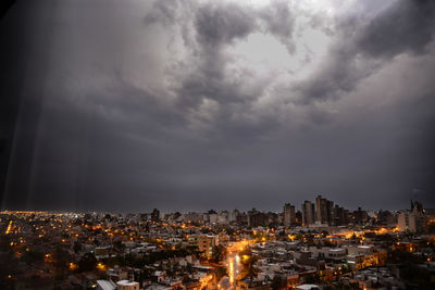 High angle view of illuminated city against sky