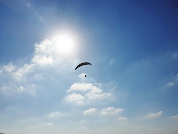 Low angle view of bird flying in sky