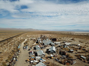 High angle view of road by houses against sky