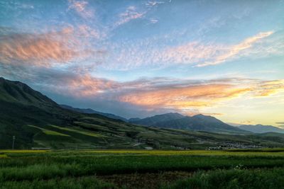 Scenic view of landscape against sky during sunset