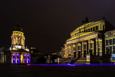 Low angle view of illuminated building at night