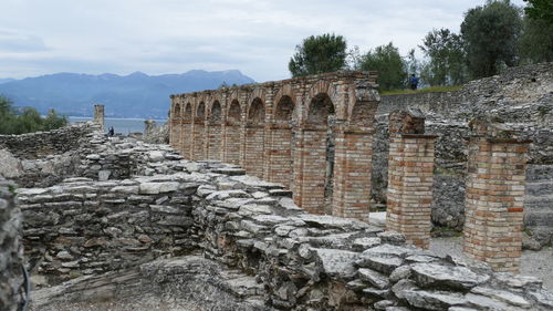 Old ruin building against cloudy sky