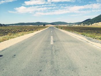 Empty road along landscape