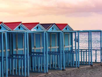 Beach huts against sky