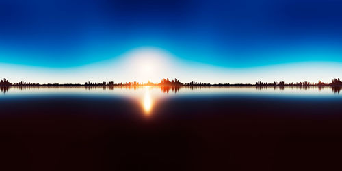 Scenic view of lake against clear blue sky