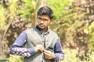 Full length of young man standing outdoors