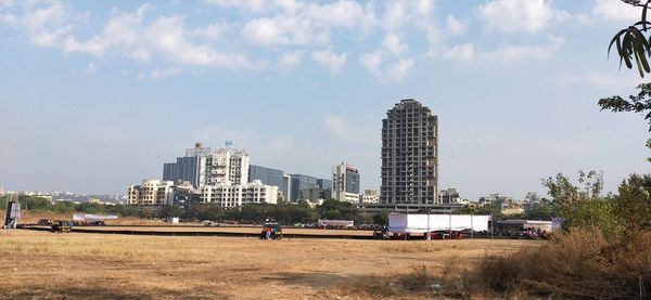 Buildings in city against sky