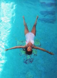 Woman swimming in pool