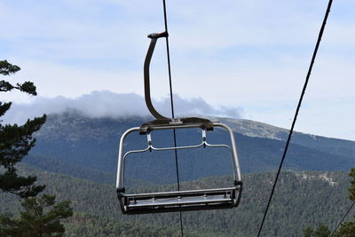 Tilt image of ski lift against sky