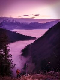 Purple sunset mountains with valley clouds 