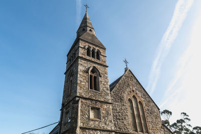 Low angle view of building against blue sky