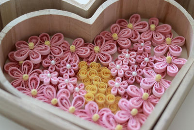 High angle view of pink roses in box