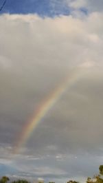 Low angle view of rainbow against sky