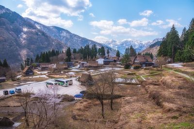 Panoramic view of buildings and mountains against sky