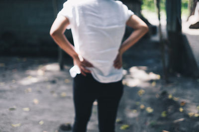 Rear view of a woman walking on floor