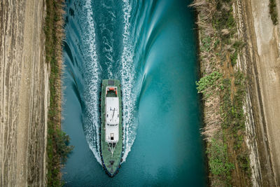 High angle view of boat sailing on lake