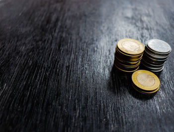 High angle view of coins on table