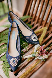 High angle view of shoes and flower