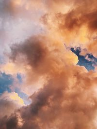 Low angle view of dramatic sky during sunset