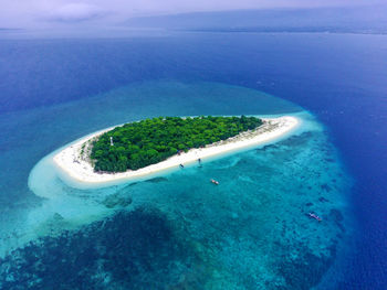 The small island named tabuhan in the beautiful clear waters of the bali straits. banyuwangi.