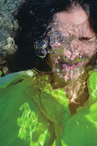 High angle view of woman swimming in sea