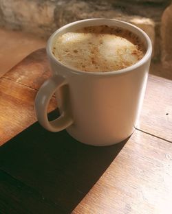 High angle view of coffee cup on table