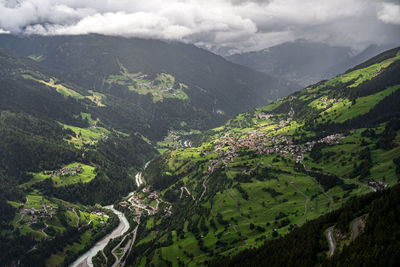 Scenic view of valley and mountains against sky