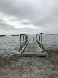 Pier over sea against sky