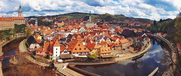 View of townscape against cloudy sky