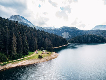 Scenic view of lake and mountains against sky