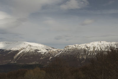 Scenic view of snowcapped mountains against sky