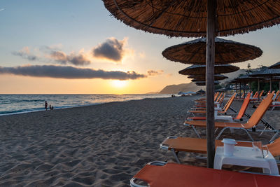 Scenic view of beach against sky during sunset