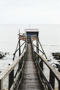 Pier over sea against sky