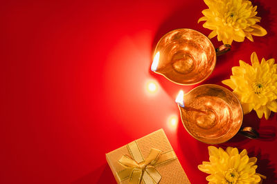 Directly above shot of christmas decorations on yellow background