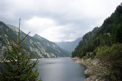 Scenic view of lake and mountains against sky