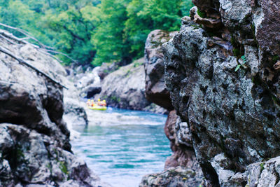 Scenic view of river flowing through rocks