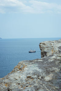 Sailboat in sea against sky