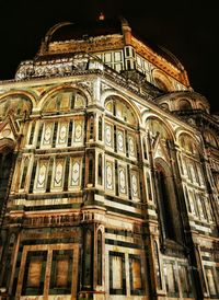 Low angle view of illuminated cathedral against sky