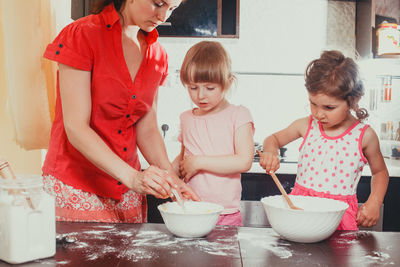 High angle view of women standing on table