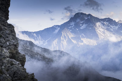 Scenic view of snowcapped mountains against sky