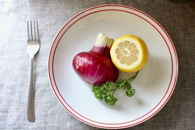 High angle view of fruits in plate on table