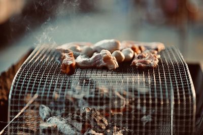 Close-up of meat on barbecue grill