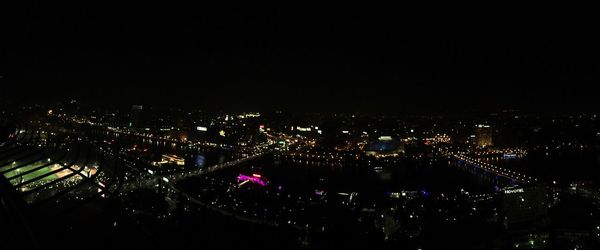 High angle view of illuminated buildings in city at night