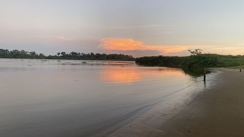 Scenic view of lake against sky during sunset