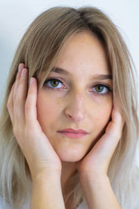 Portrait of a beautiful young woman over white background