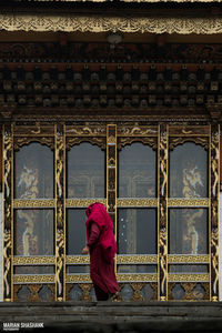 Low angle view of woman walking in temple building