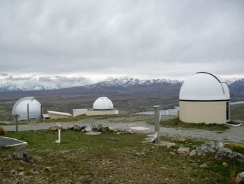 Built structure on land against sky