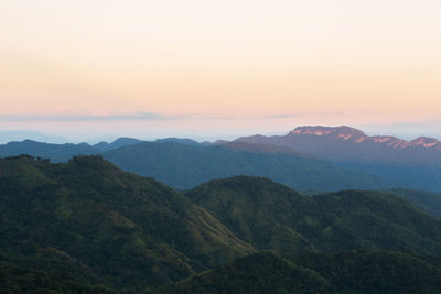 Scenic view of mountains against sky during sunset